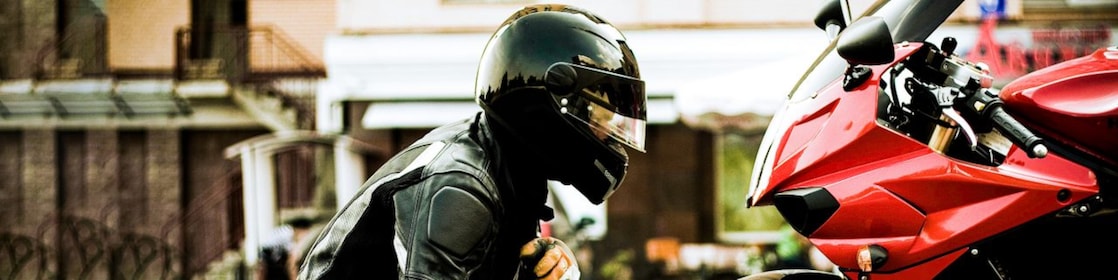 Person looking at his motorcycle
