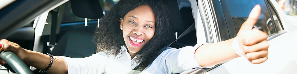 Happy women sitting in white car